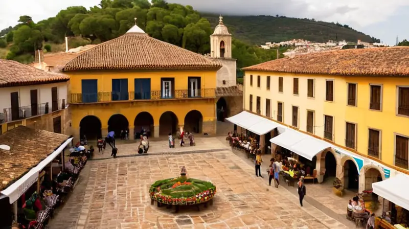 En la plaza de un pueblo andaluz vibrante y soleado, personajes de todas las edades pasean entre antiguos edificios de piedra rodeados por la Sierra de Aracena